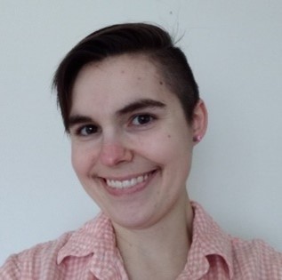 Katie Peterson headshot. A white woman with short, brown hair.